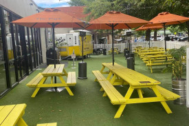 artificial turf, picnic tables, umbrellas